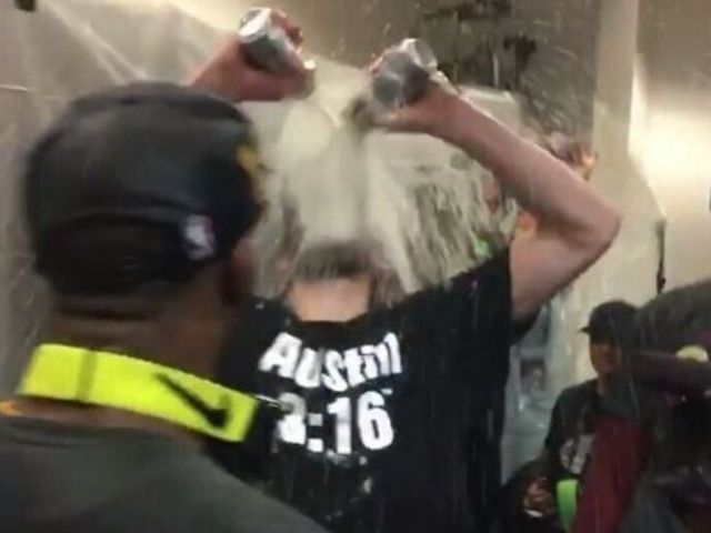 Love dons 'Austin 3:16' shirt, celebrates title win like WWE star