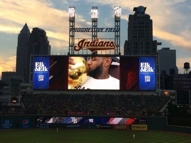 LeBron smooches NBA trophy on Kiss Cam at Indians game