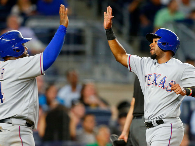 Rangers top Yankees with wild rally in 9th after nearly 4-hour delay