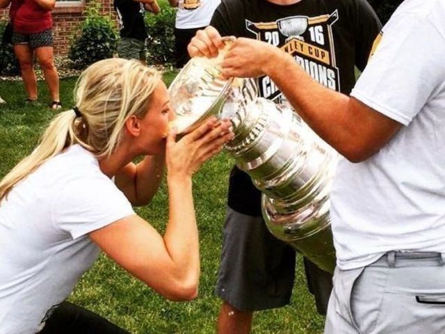Amanda Kessel drinks from Stanley Cup