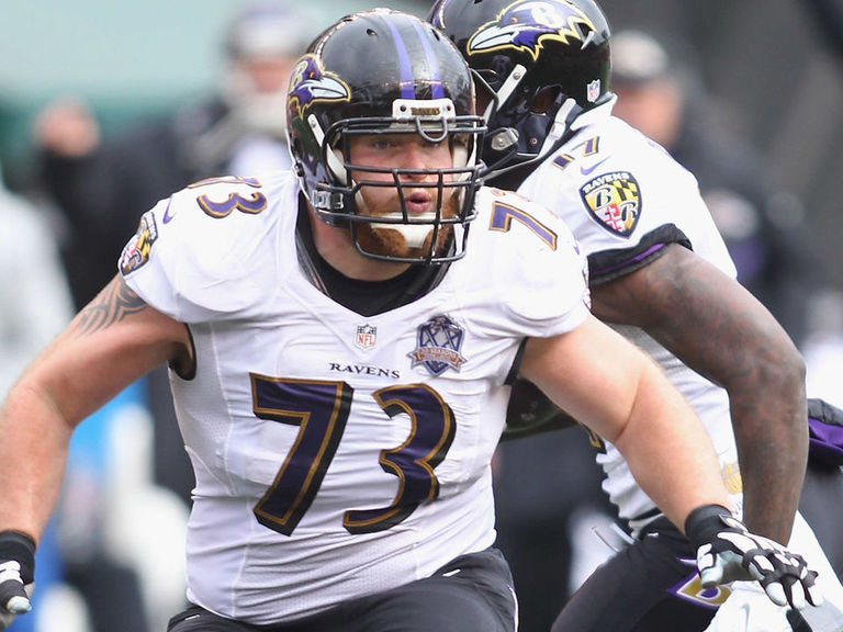 Baltimore Ravens' Marshal Yanda spits at Bengals' Vontaze Burfict