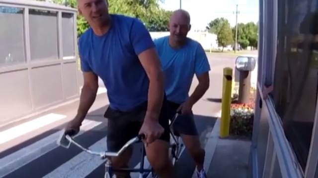 Hasselbeck arrives for first day at ESPN on tandem bicycle with brother