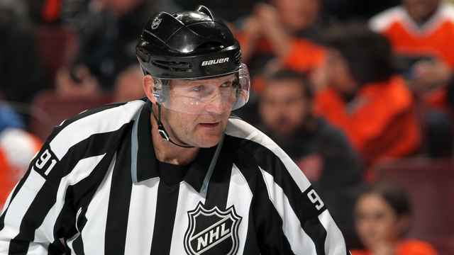 Report: Linesman hit by Wideman had neck surgery, career may be over