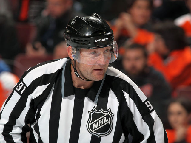 Report: Linesman hit by Wideman had neck surgery, career may be over