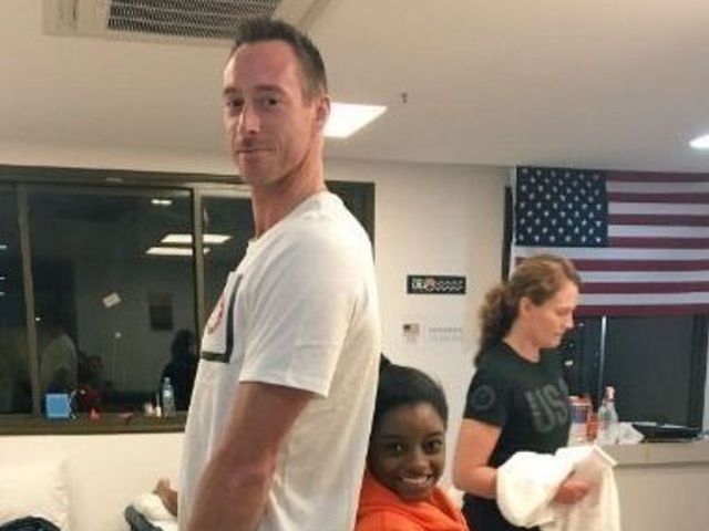 Volleyball star David Lee towers over Simone Biles