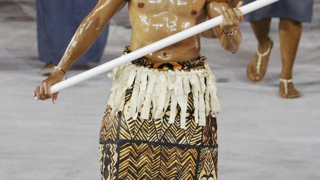 Tonga's shirtless flag bearer comes in hot