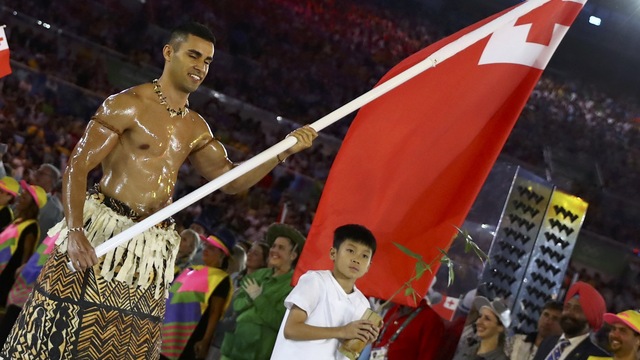 Watch: 'Today' correspondents rub oil on Tonga flag bearer