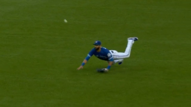 Watch: Bautista trips on turf, gives up extra base