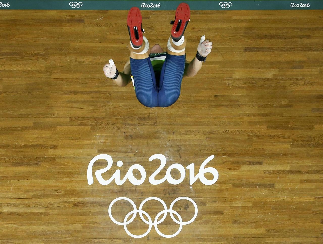 Watch Lithuanian weightlifter flawlessly backflips after winning