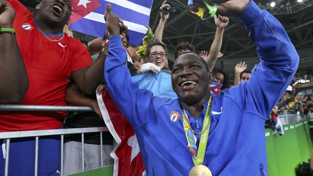 Cuban wrestler Mijain Lopez rolls to 3rd Olympic title