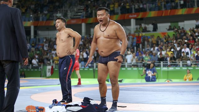 Mongolian wrestling coaches strip down in protest of controversial loss