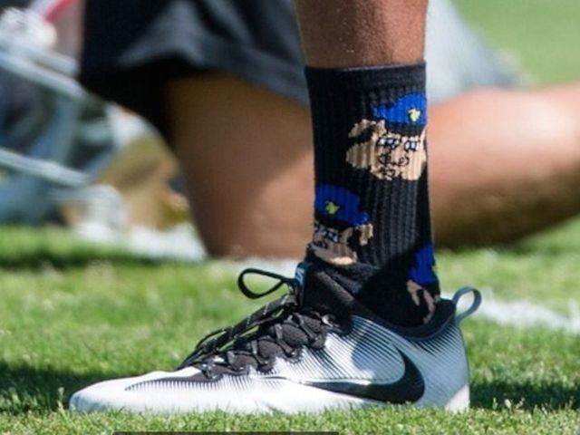 Kaepernick's practice socks depict cops as pigs