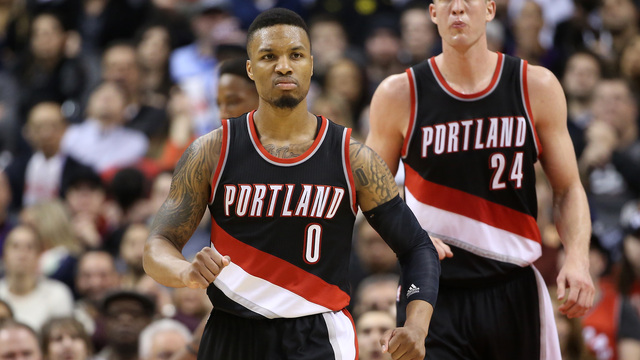 Watch: Lillard barrels into 1st row, takes out Wolves' owner