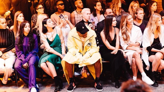 Westbrook shows off legs in yellow coat at New York Fashion Week