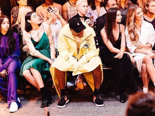 Westbrook shows off legs in yellow coat at New York Fashion Week