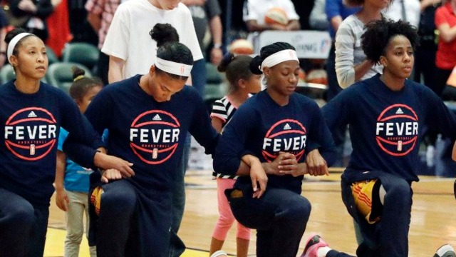 WNBA's Fever kneel together as team in anthem protest