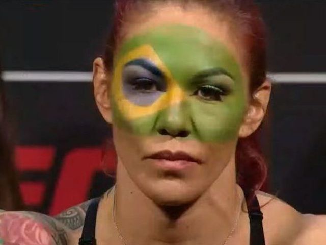 Cyborg rocks Brazilian flag face paint at weigh-ins