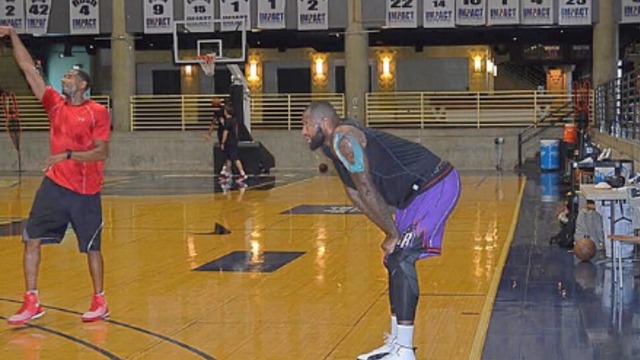 Boogie works out in retro Raptors shorts