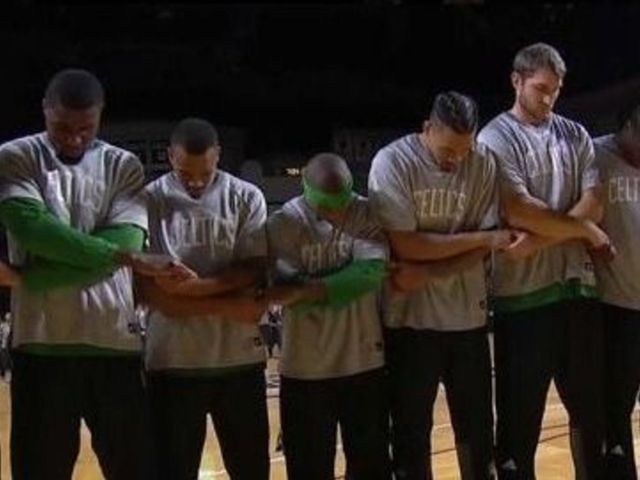 Celtics link arms in show of unity during national anthem