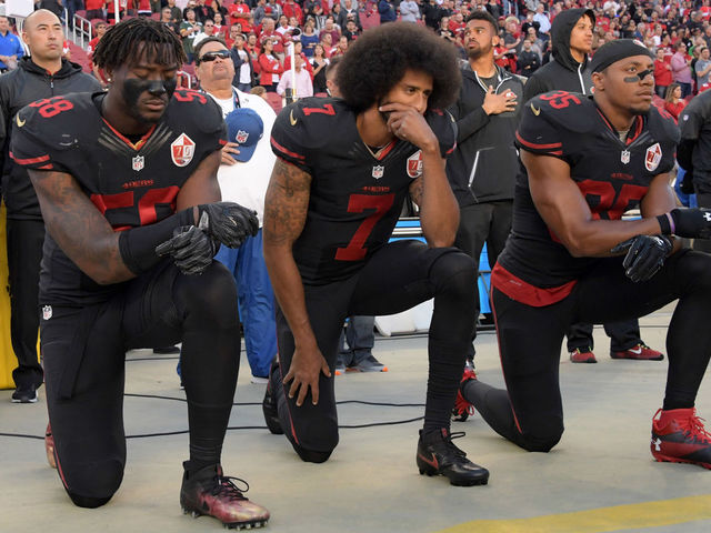 Kaepernick's girlfriend denies report QB will stand for anthem if signed