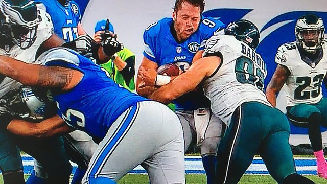 Helmetless Stafford gets crunched by Eagles