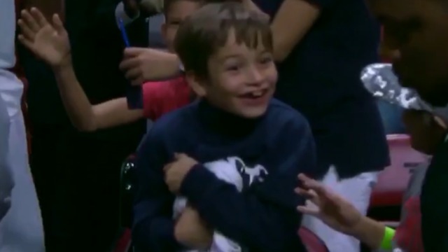 Whiteside gifts warmup shirt to young fan