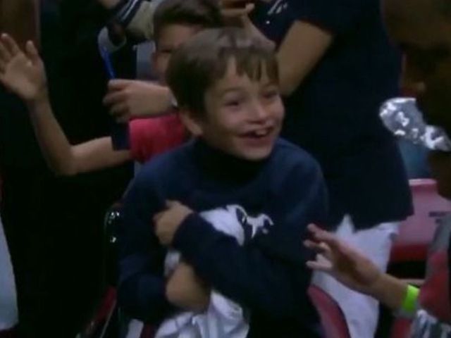 Whiteside gifts warmup shirt to young fan