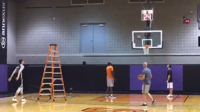 Suns' Bender practices shooting over giant ladder