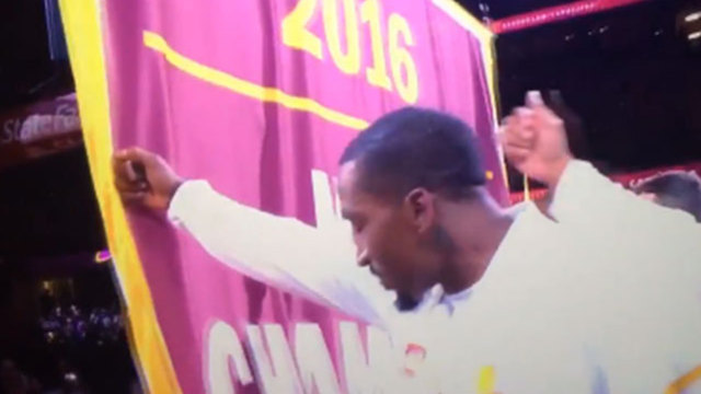 Cavs raise Cleveland's 1st championship banner in 52 years