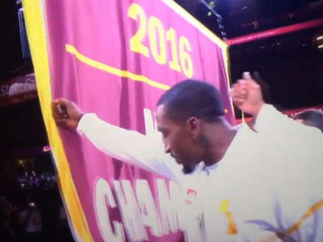 Cavs raise Cleveland's 1st championship banner in 52 years