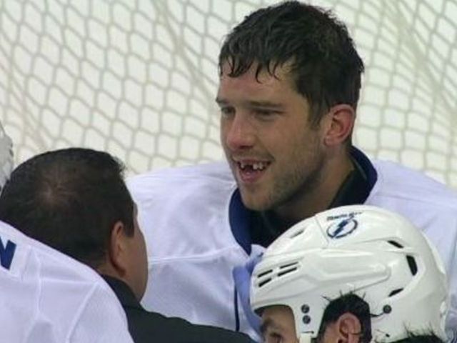 Watch: Bishop loses 2 front teeth after taking Holland shot to the face