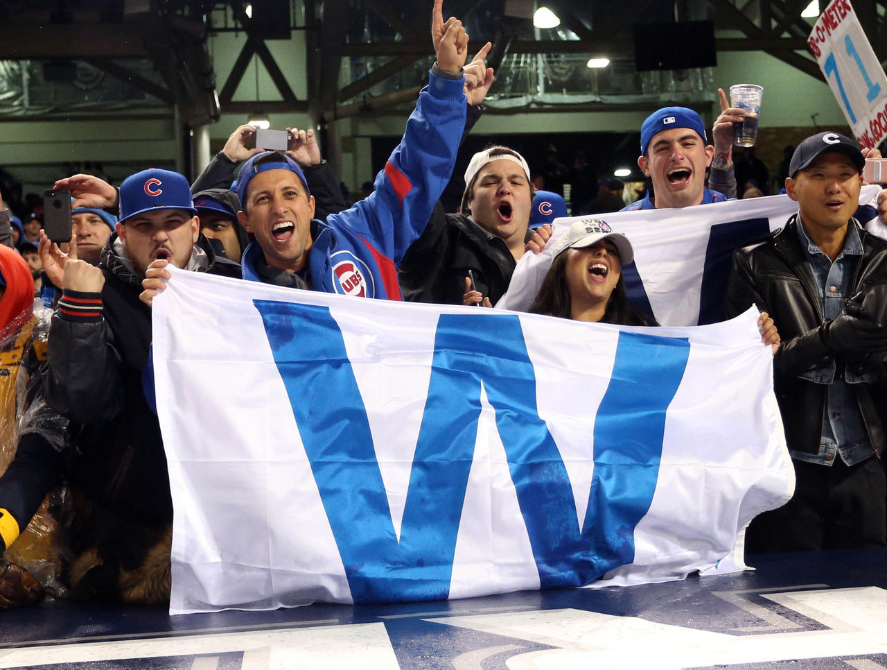 This trio of football fans in the stands of Chicago's Wrigley