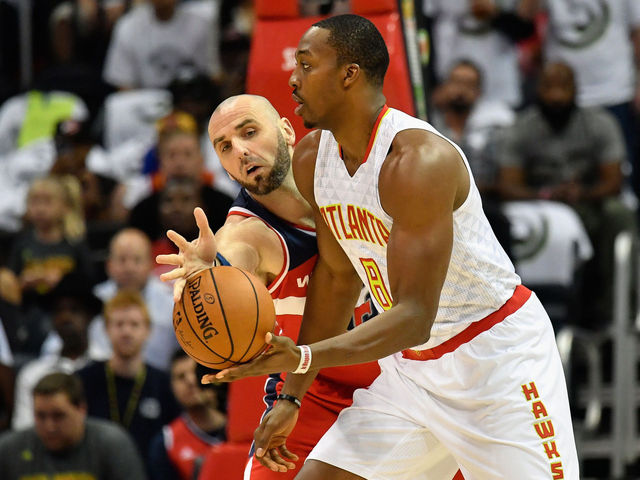 Howard gobbles up 19 rebounds in Hawks debut