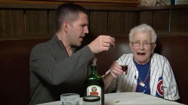 Elderly Cubs fan does Jager shot with TV anchor