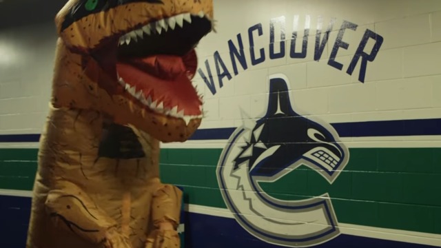 Markstrom dresses as 7-foot dinosaur, terrifies Canucks