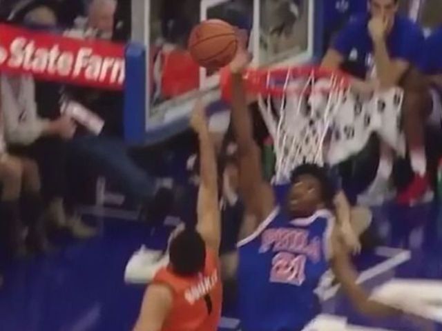 Embiid sends Booker's layup attempt into first row