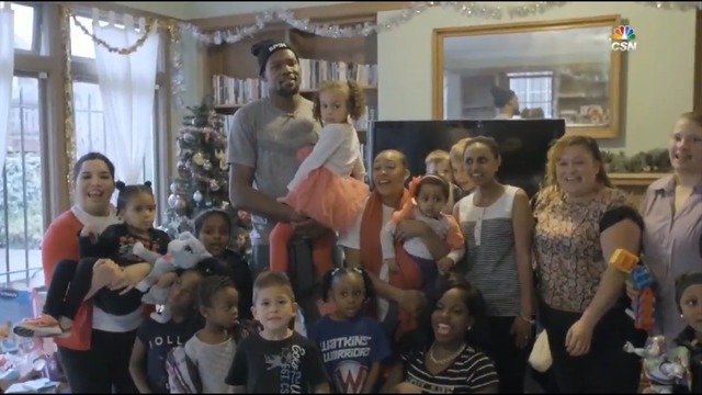 Durant plays Santa to families affected by poverty, violence