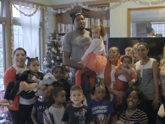 Durant plays Santa to families affected by poverty, violence