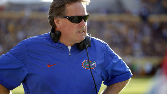 Jim McElwain adamantly denies being naked man in viral shark picture