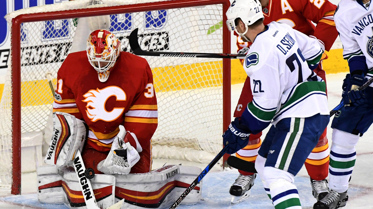Johnson stops 28 as Flames end Canucks' 6-game winning | theScore