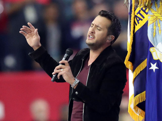 Luke Bryan's anthem goes under at 2:04, no players kneel