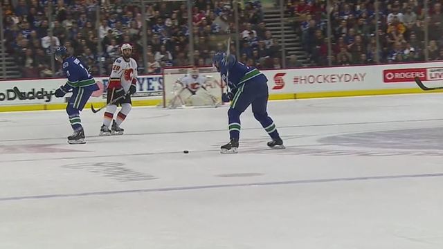 Edler's knuckler from center ice eludes Elliott