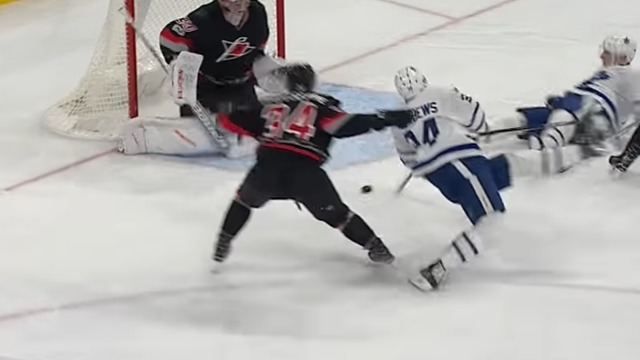 Watch: Matthews scores incredible backhand goal while being hauled down