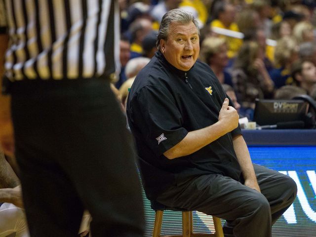 West Virginia's Huggins pokes fun at own weight