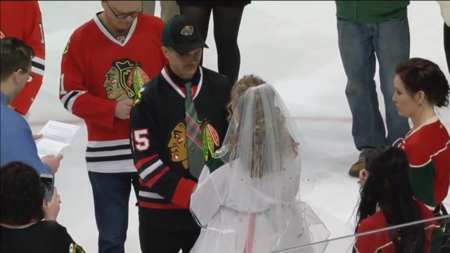 Blackhawks fan marries Wild fan on ice before game