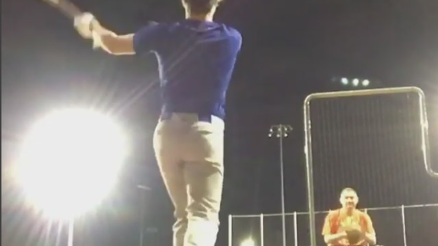 Youth baseball player drills moving car during batting practice