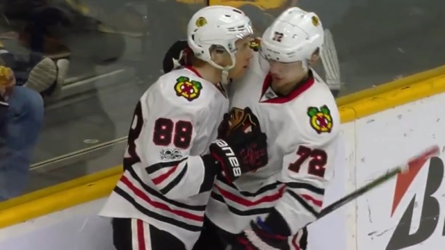 Panarin rejects Kane's kiss after setting up empty-net goal