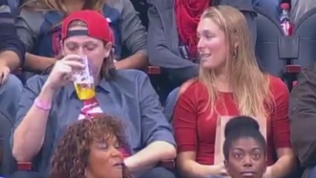 Snubbed Hawks fan kisses stranger on Kiss Cam