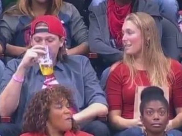Snubbed Hawks fan kisses stranger on Kiss Cam