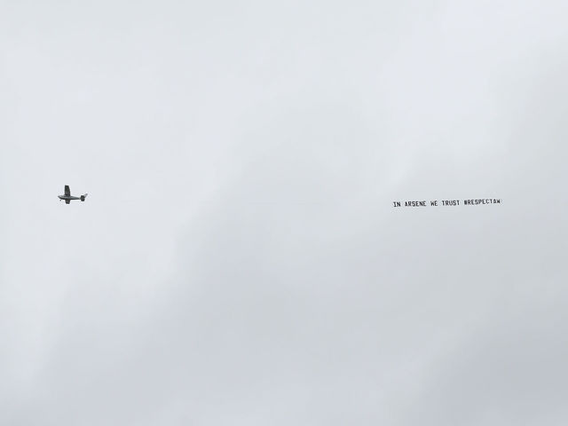 Look: Duelling Wenger banners mar West Brom visit